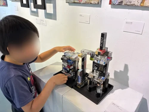 The shifting visual of Jenga balanced precariously by visitors' choices